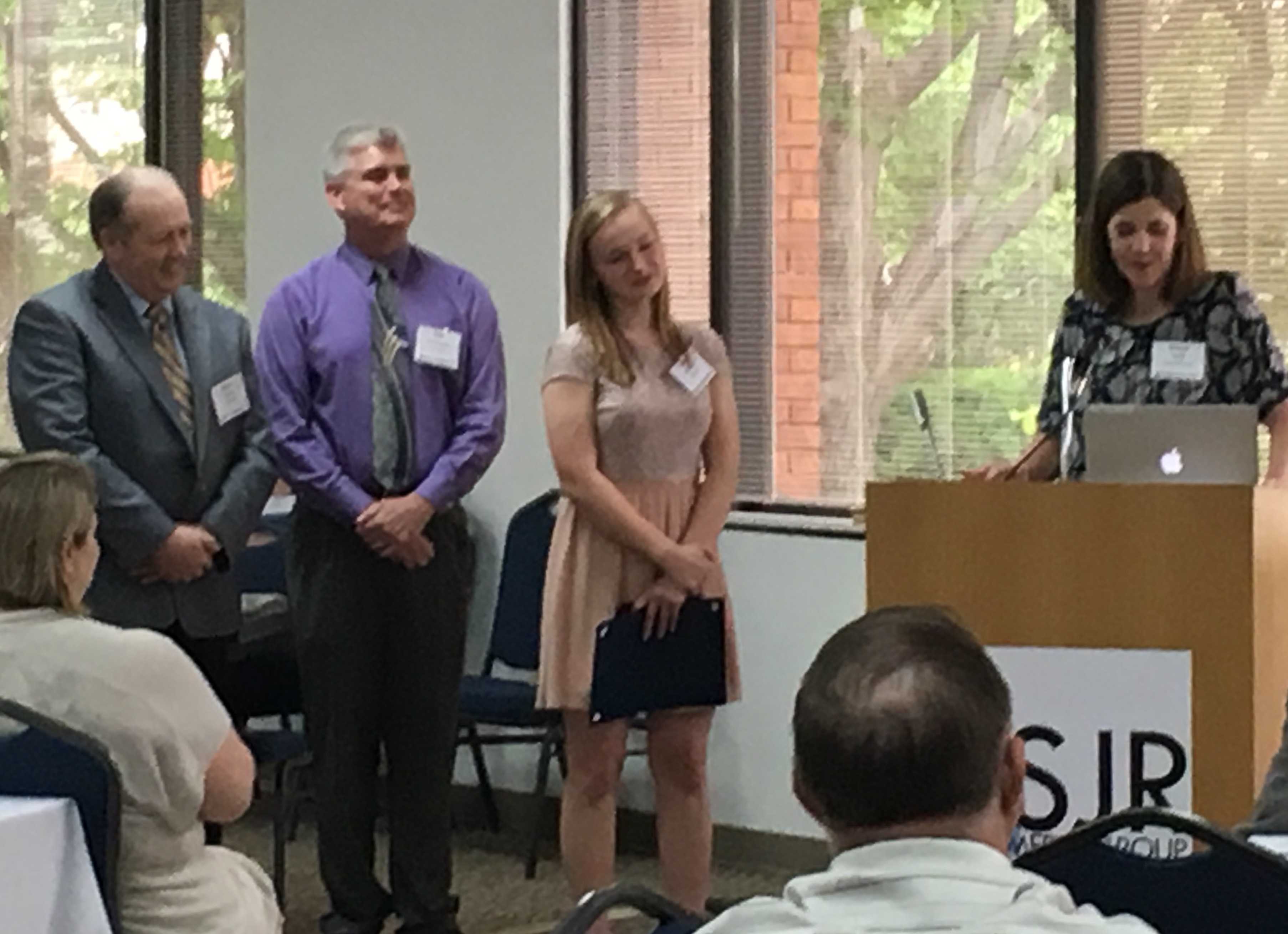 IJEA State Director Brenda Field presents the award for IJOY Runner-Up and later the IJEA Inspiration Award to Taylorville's Hope Johnson, along with her adviser Stephen Steele