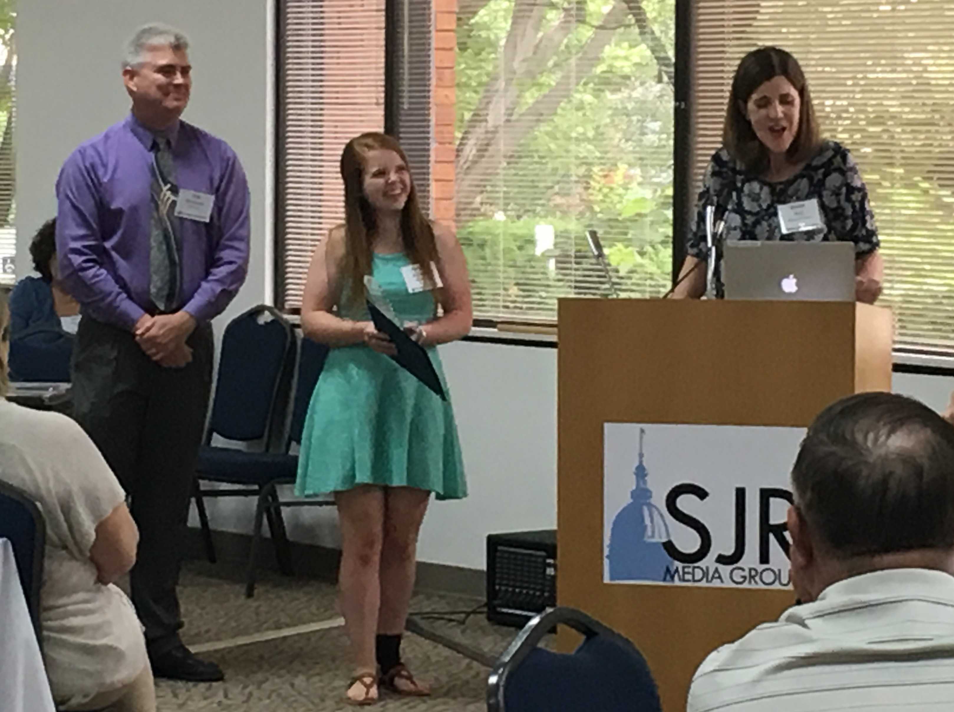 IJEA State Director Brenda Field speaks about 2016 Illinois Journalist of the Year Hannah Boufford along with IJEA President Brad Bennewitz.