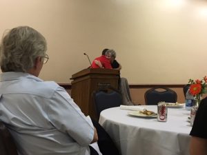 IJEA Vice President John Gonczy introduces and then embraces Linda Jones as she is presented with the Friend of Scholastic Journalism award for 2016.