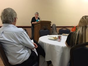 Linda Jones, 2016 Friend of Scholastic Journalism, accepts her award at the IJEA Fall Conference on Sept. 16 at the University of Illinois Urbana-Champaign in front of other Illinois advisers.
